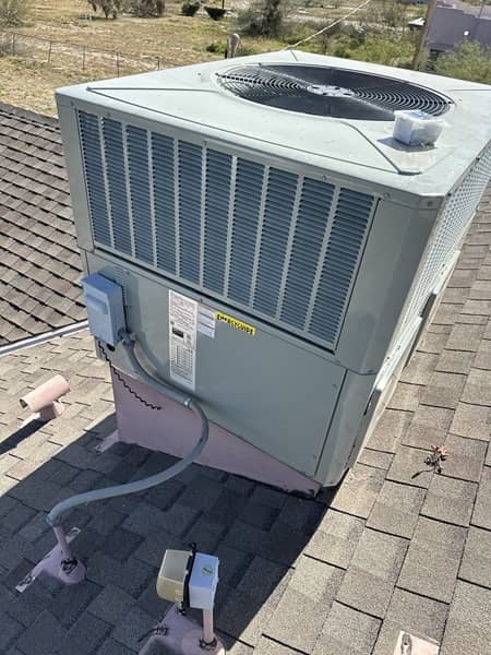 Outdoor AC unit on a home's roof